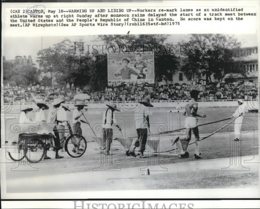 1975 Press Photo Workers re-mark Lanes at Track Meet in Canton, China vs. USA - Historic Images