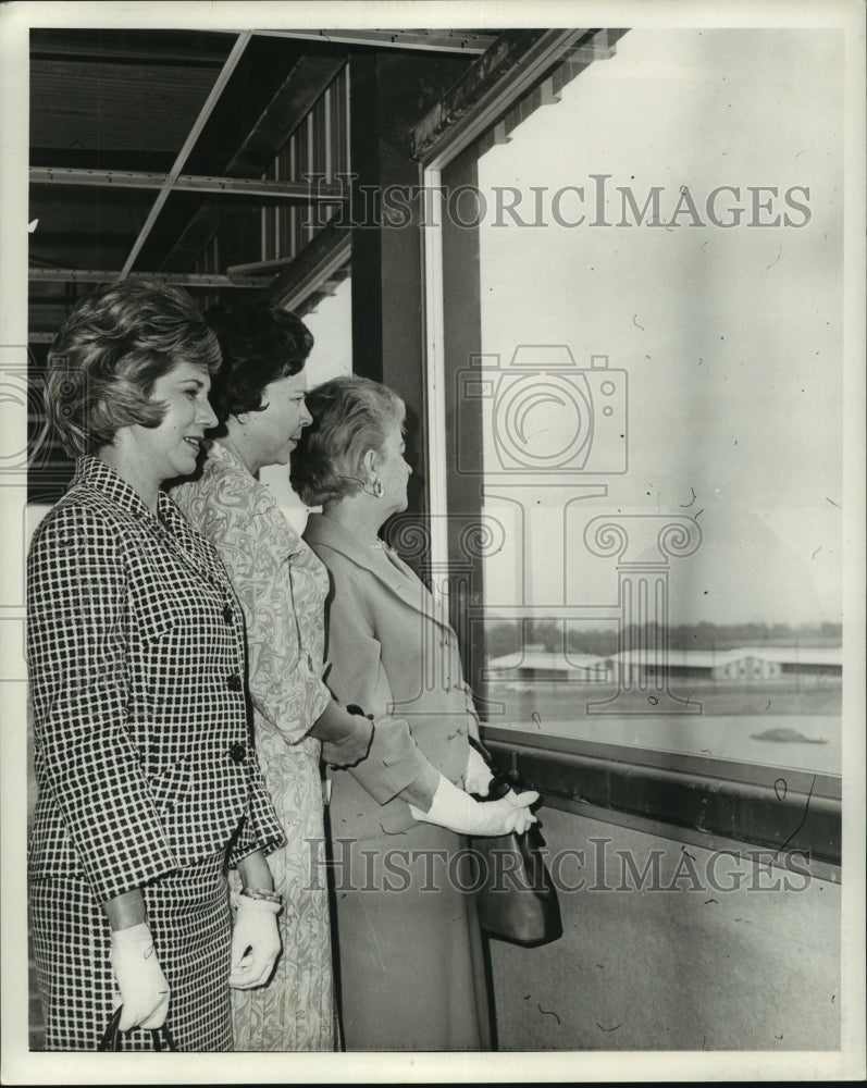 Press Photo Three Women Look Out Window at Horse Races - nos10711 - Historic Images