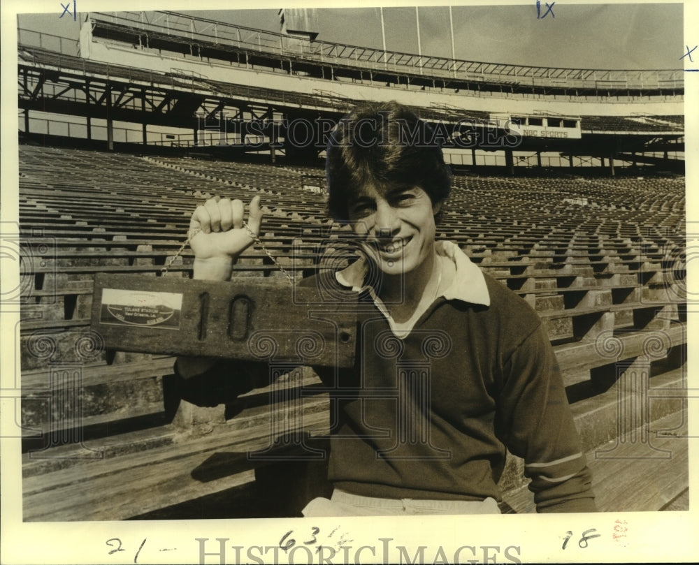 1979 Press Photo Steve Foley, Football Player Holds Number Sign at Stadium - Historic Images