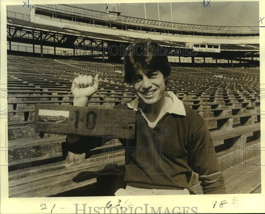 1979 Press Photo Steve Foley, Football Player Holds Number Sign at Stadium - Historic Images