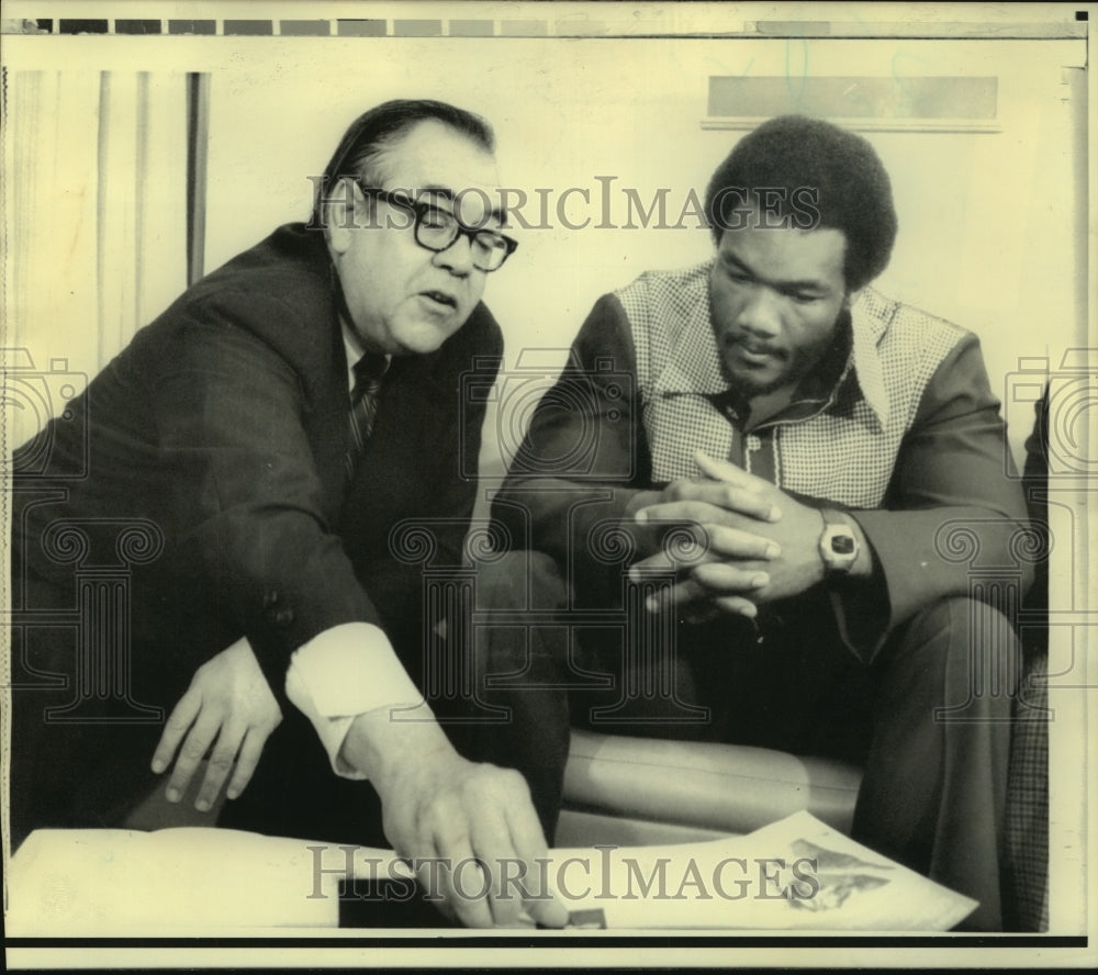 1974 Press Photo Boxer George Foreman with Bradford Morse at United Nations- Historic Images