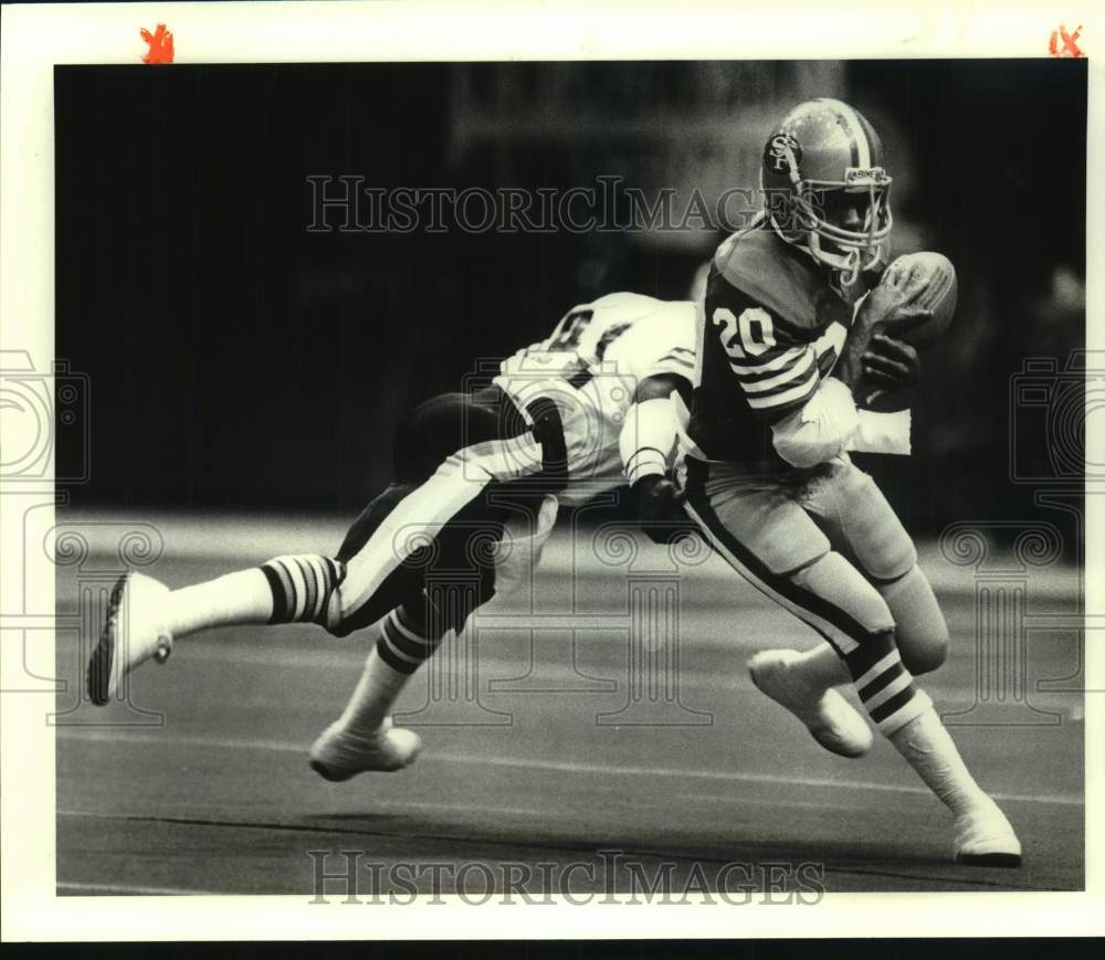 1981 Press Photo New Orleans Saints Jimmy Rogers Takes Down 49ers Amos Lawrence - Historic Images