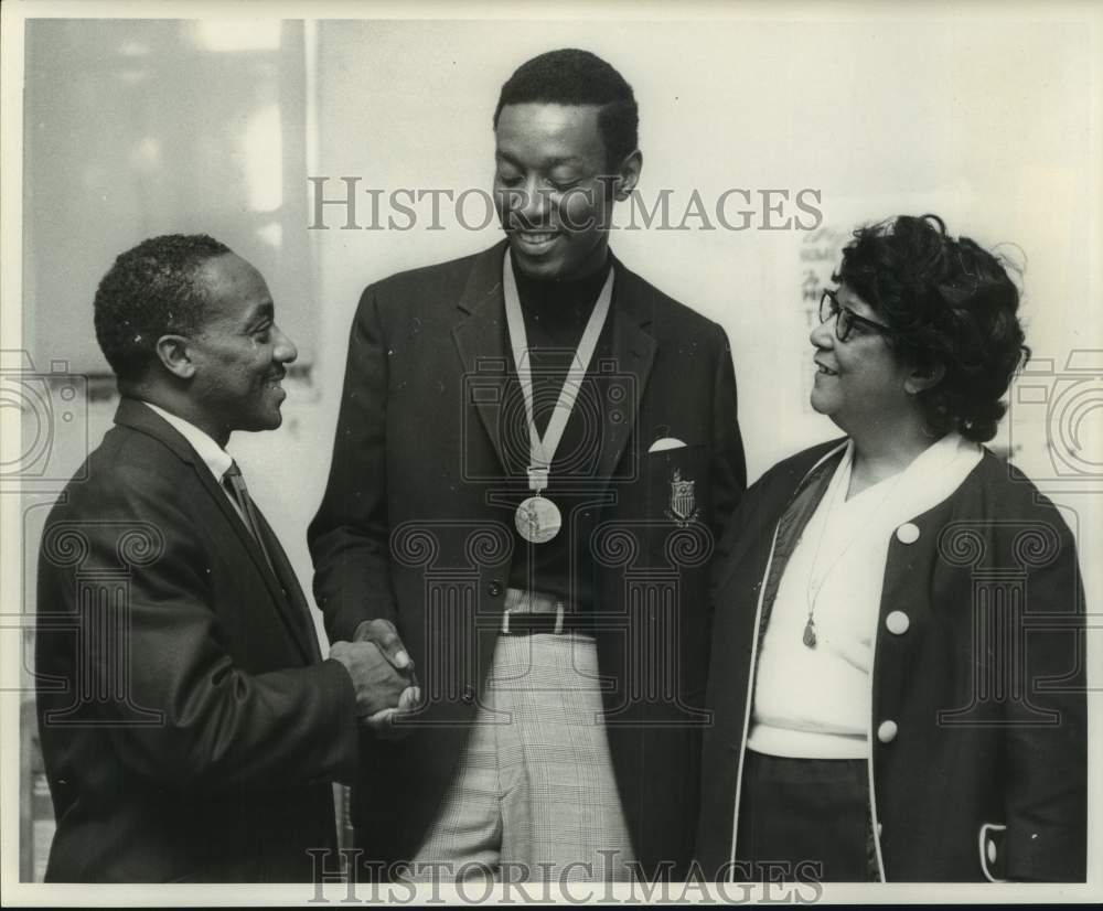 1968 James King shakes hands with man after receiving award - Historic Images