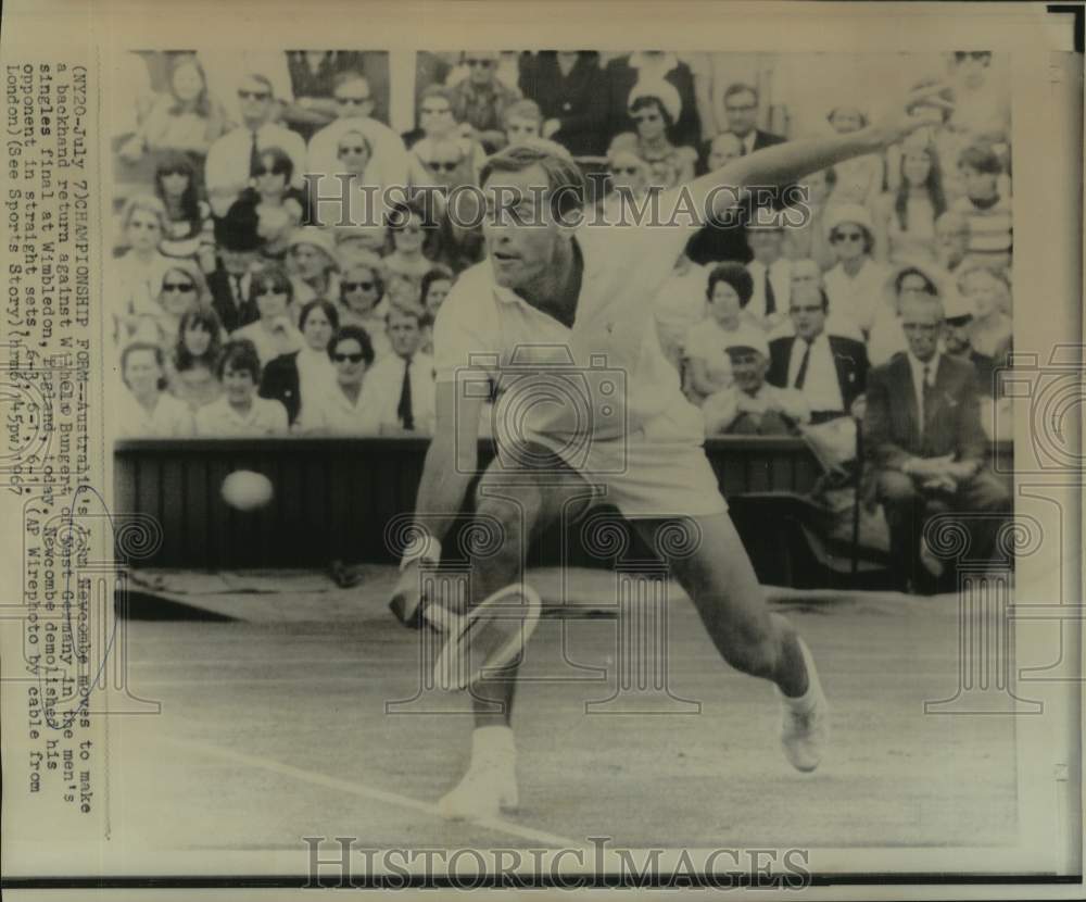 1967 Press Photo Australian tennis player John Newcombe hits a shot at Wimbledon - Historic Images