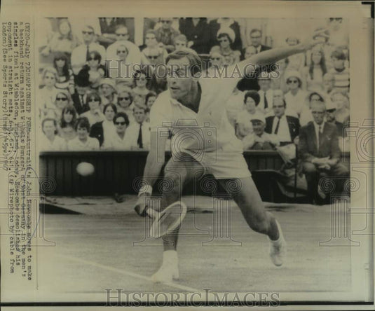 1967 Press Photo Australian tennis player John Newcombe hits a shot at Wimbledon - Historic Images