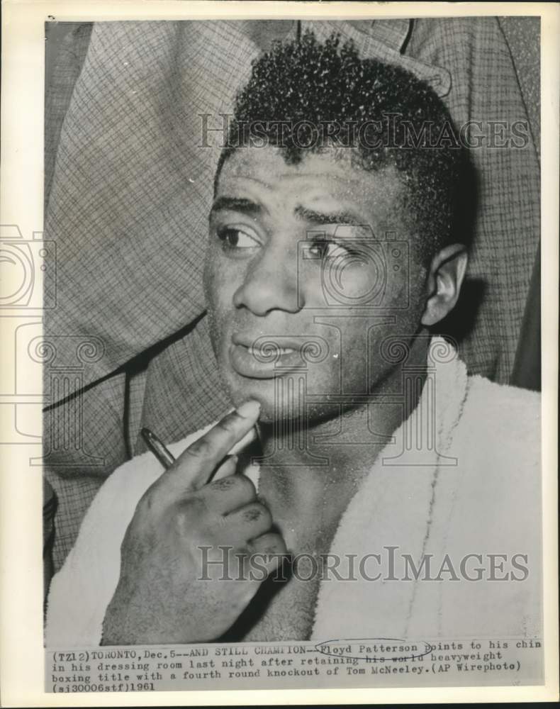 1961 Press Photo Boxer Floyd Patterson points to his chin after Toronto fight - Historic Images