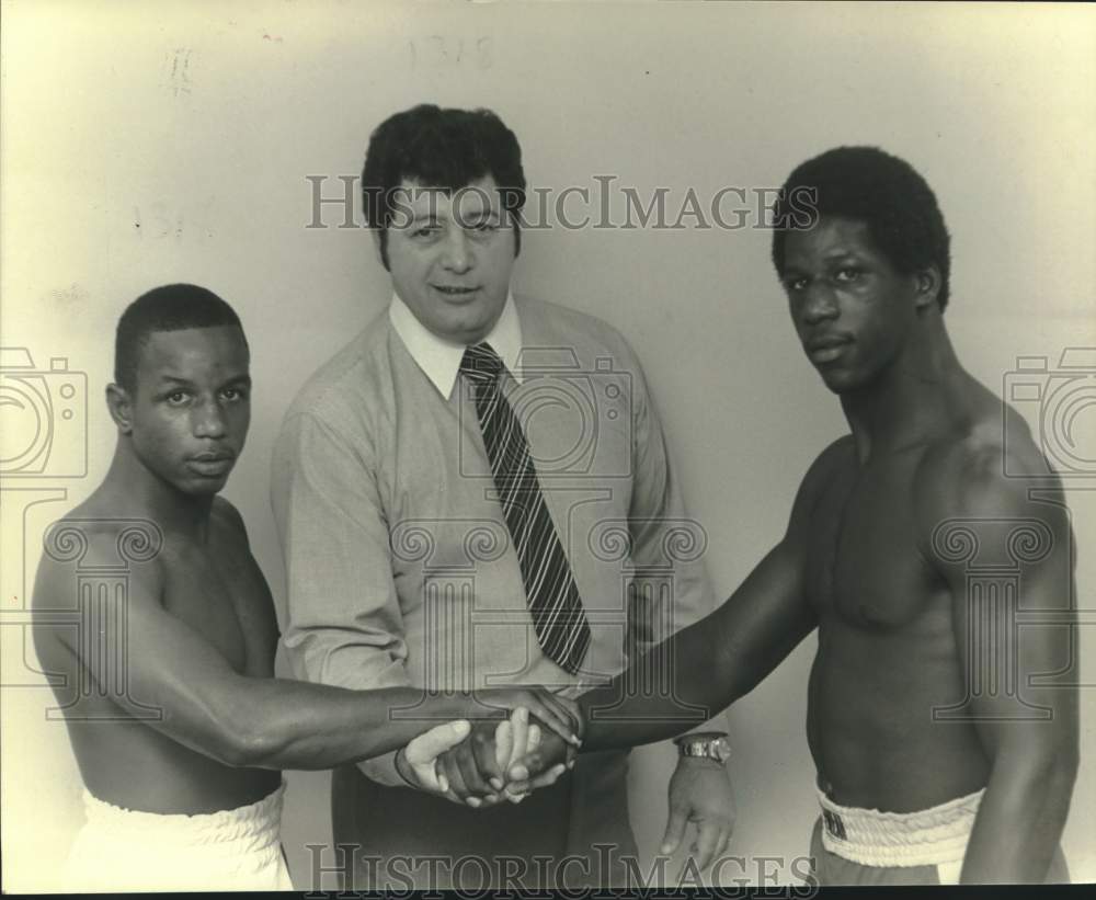 1983 Press Photo Boxers Melvin Paul &amp; Jerome Clouden pose with manager Bonano - Historic Images