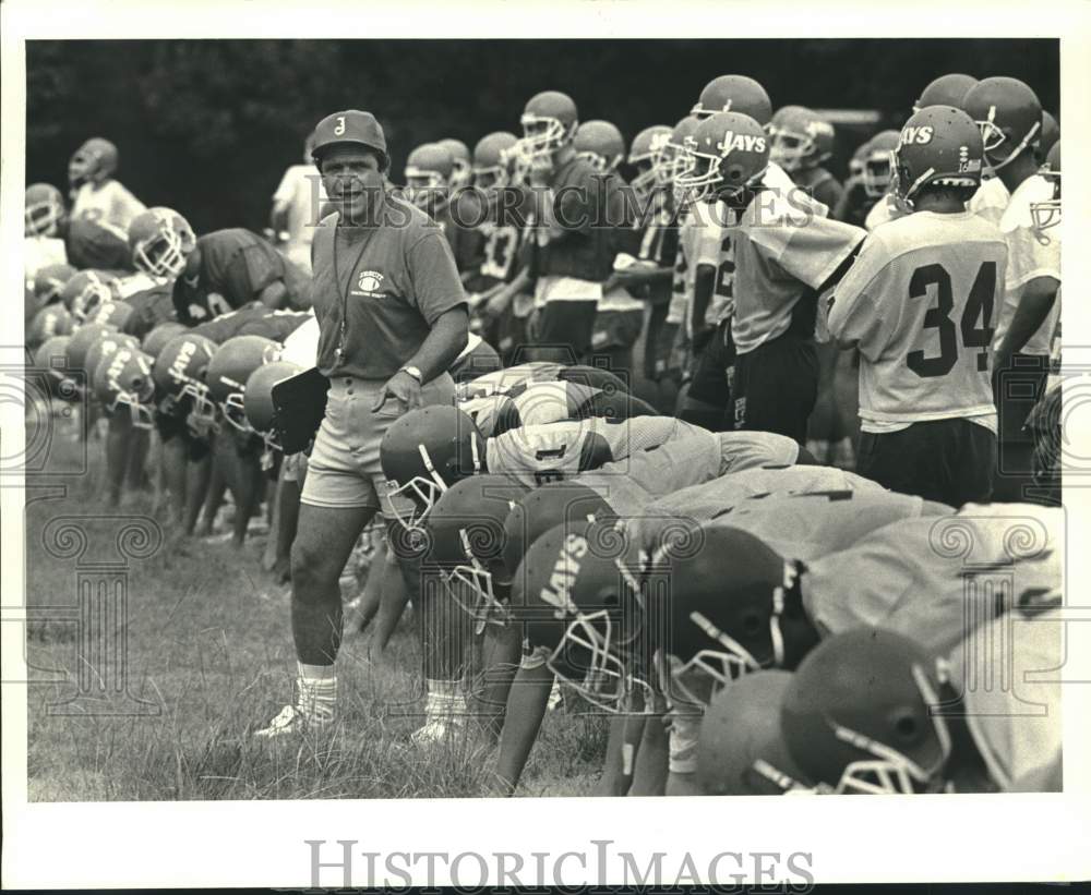 Press Photo Jesuit football coach Frank Monica works out his players in practice - Historic Images