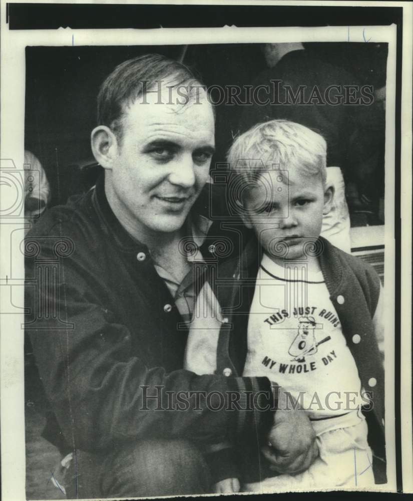 1969 Kevin Parson poses with small boy (not identified) - Historic Images