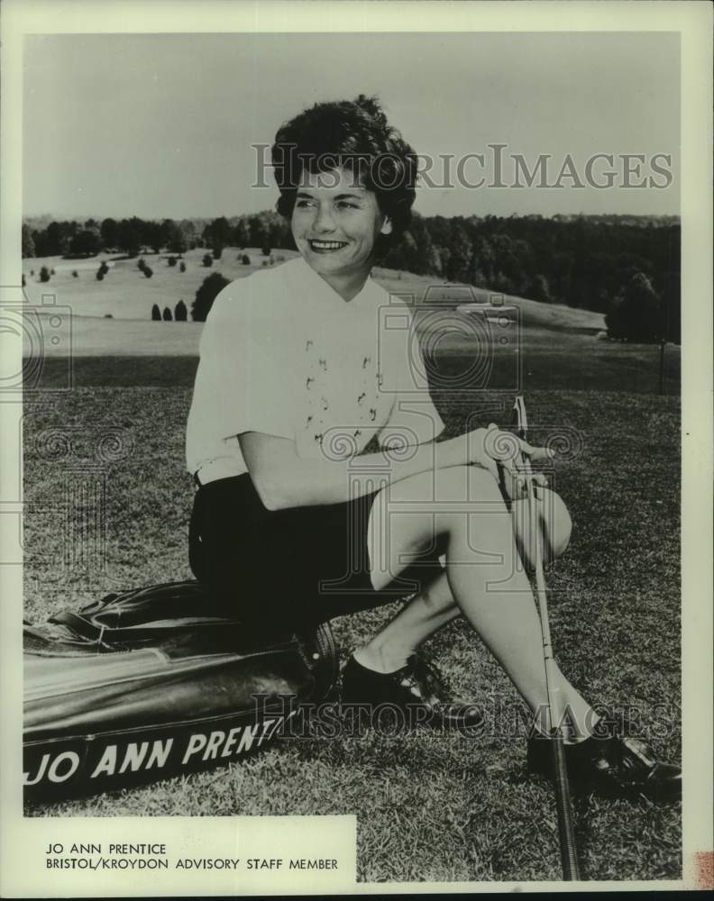 1968 Press Photo Golfer Jo Ann Prentice smiles as she sits on her golf bag - Historic Images