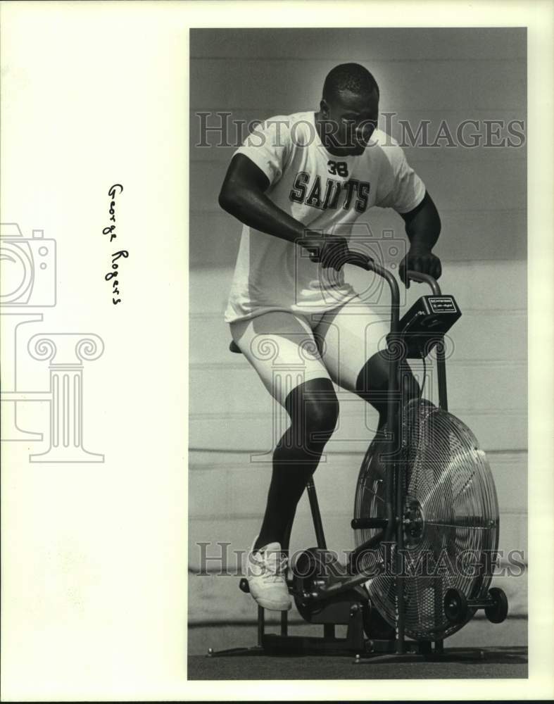 1983 Press Photo New Orleans Saints football player George Rogers on exer-bike - Historic Images