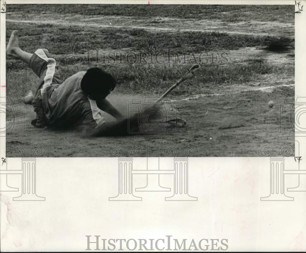 1968 Press Photo Stickball&#39;s full of spills this player takes one going for ball - Historic Images