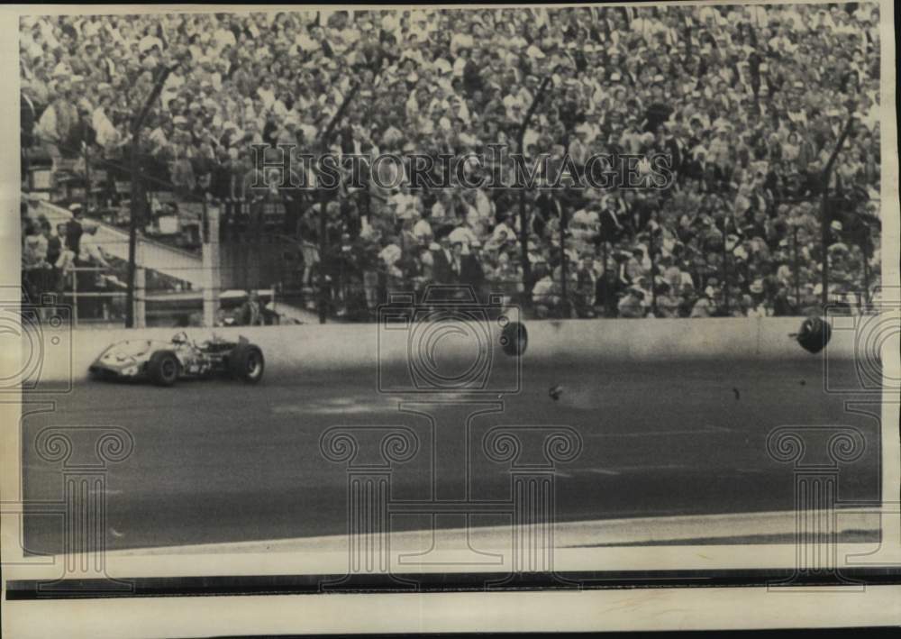 1968 Press Photo Car Racer Al Unser on Wall as Wheels Fly Off, Indianapolis 500- Historic Images