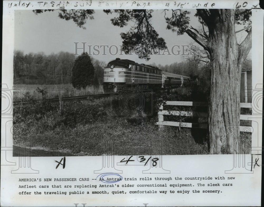 1976 Press Photo Modern Amtrak Train Rolls through Countryside - not00540 - Historic Images