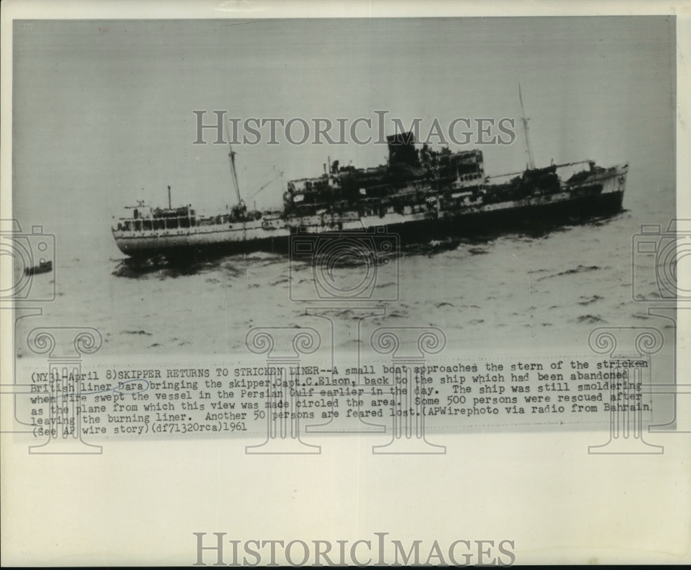 1961 A small boat approaches the British liner Dara after a fire - Historic Images