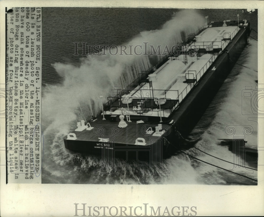 1965 A launch photo of a recently sunken barge containing chlorine - Historic Images