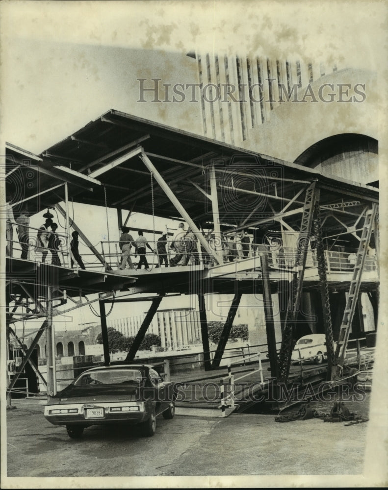 1974 Vehicles &amp; passengers load onto the Algiers ferry boat - Historic Images