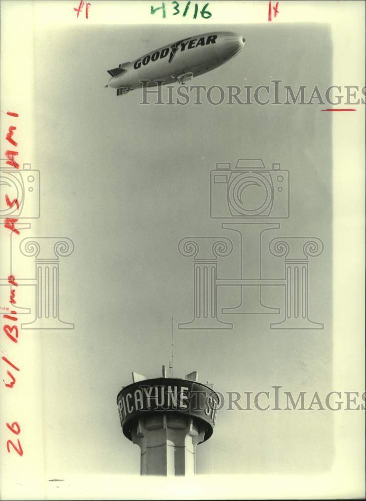 1986 A Goodyear Blimp flies over Picayune tower - Historic Images