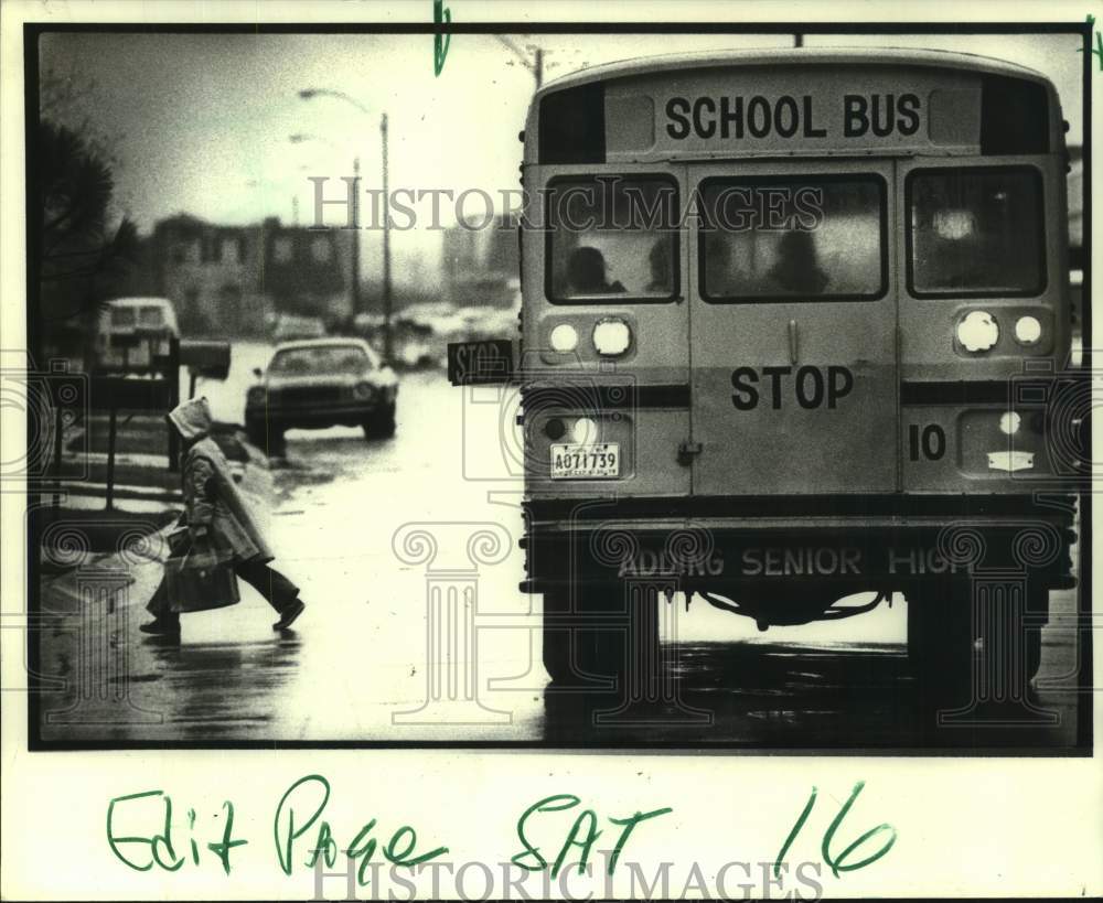 1979 Scene of stopped school bus and child crossing street - Historic Images