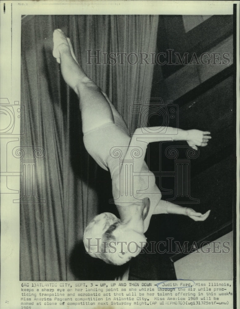 1969 Judith Ford, Miss IL, practices trampoline & acrobatic act - Historic Images