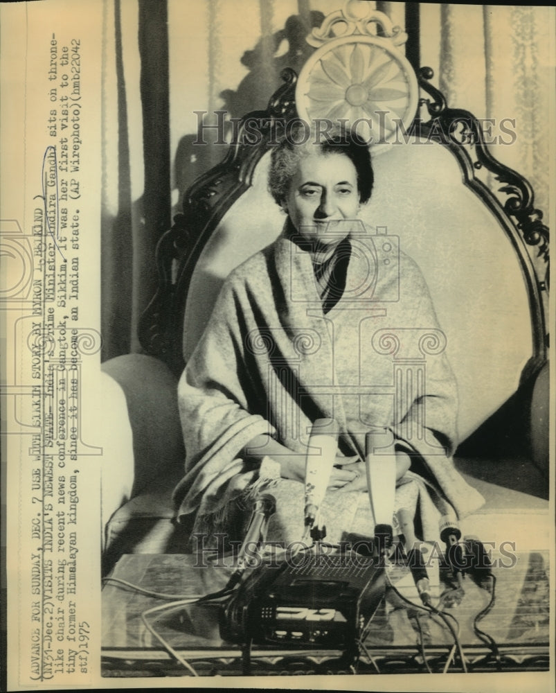 1975 Indira Gandhi sits in throne-like chair at news conference - Historic Images