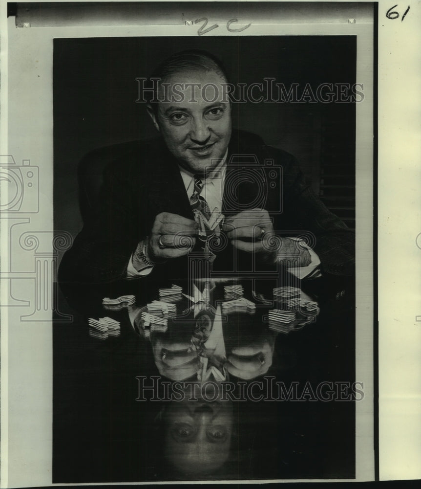 Victor Frenkil, shown years ago making initials out of dollar bills - Historic Images