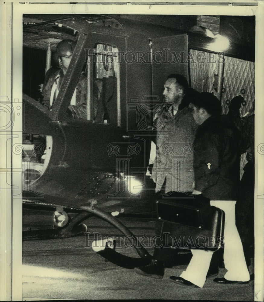 1971 Richard Fecteau with Army medic leaves helicopter in PA - Historic Images