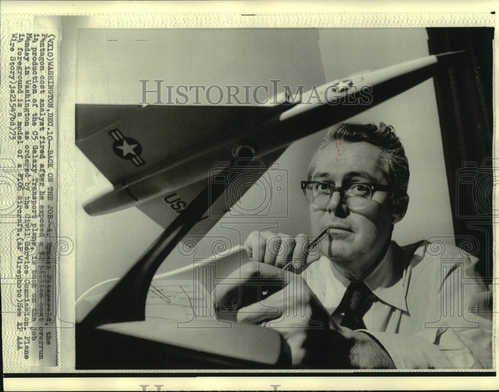 1973 Ernest Fitzgerald, Pentagon cost analyst, with F106 model plane - Historic Images