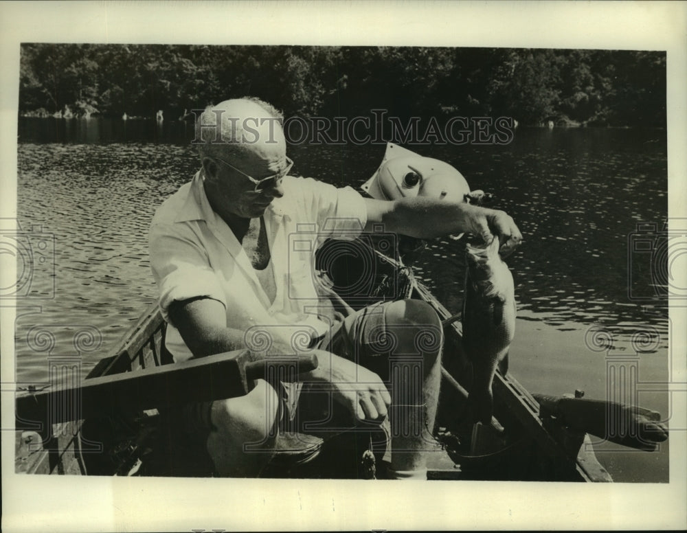1947 Press Photo Clint Fleming, Canada's famous fishing guide, has written book-Historic Images