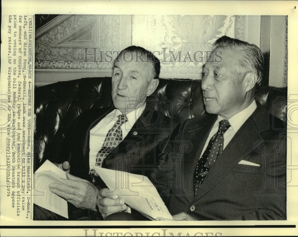 1974 Sens. Mansfield &amp; Fong look over pay raise amendment bill - Historic Images