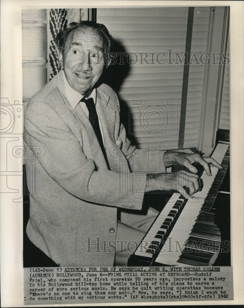 1962 Rudolf Friml at the keyboard in his Hollywood home - Historic Images