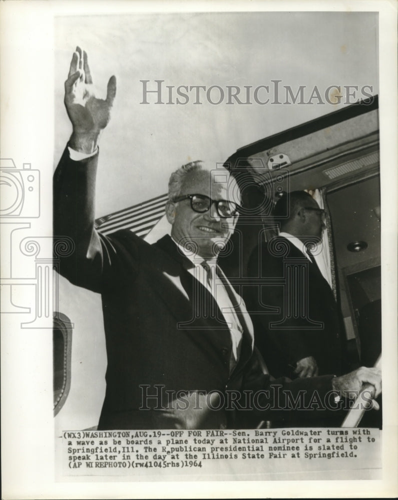 1964 Senator Barry Goldwater turns &amp; waves as he boards plane - Historic Images