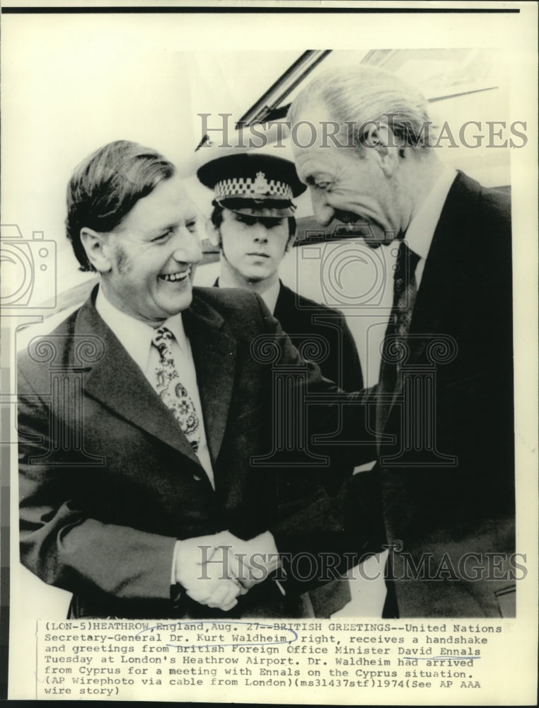 1974 Dr. Waldheim receives handshake from David Ennals at Heathrow - Historic Images