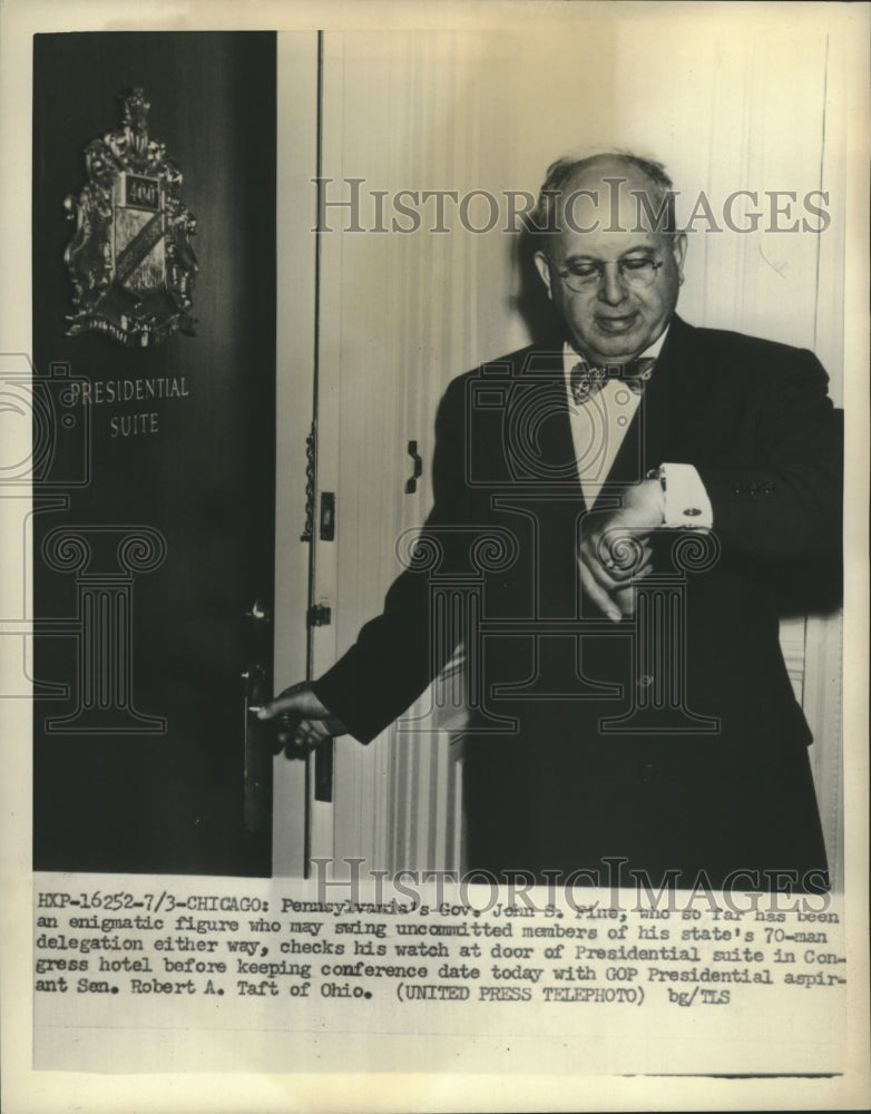 1952 Press Photo Gov. John Fine checks watch at door of Presidential Suite-Historic Images