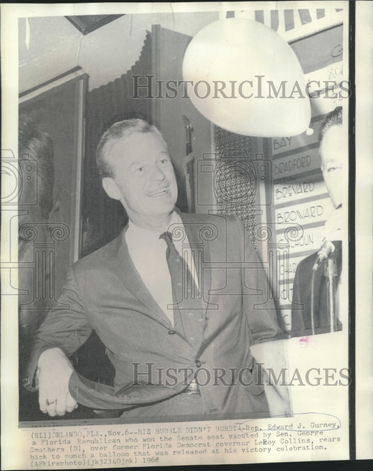 1968 Press Photo Senator Edward Gurney punches at balloon at victory party in FL-Historic Images