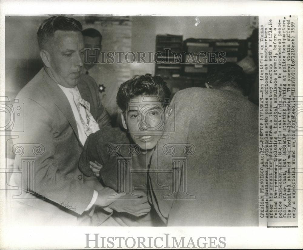 1959 Press Photo Thomas Gutierraz struggles with officers at police headquarters-Historic Images