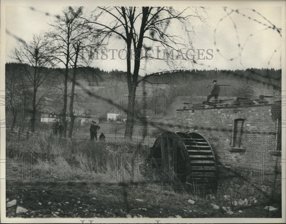 1960 East German workers raze mill at Hainersberg, Germany border - Historic Images