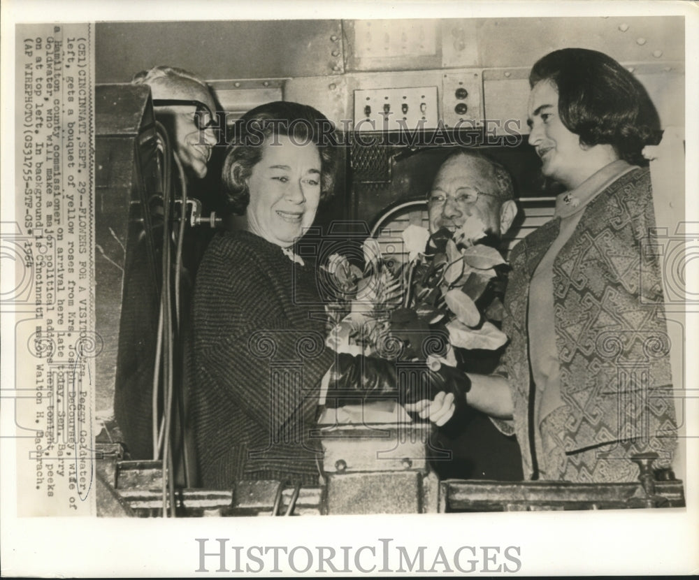 1964 Press Photo Mrs. Goldwater gets roses from Mrs. DeCoursey as others look on-Historic Images