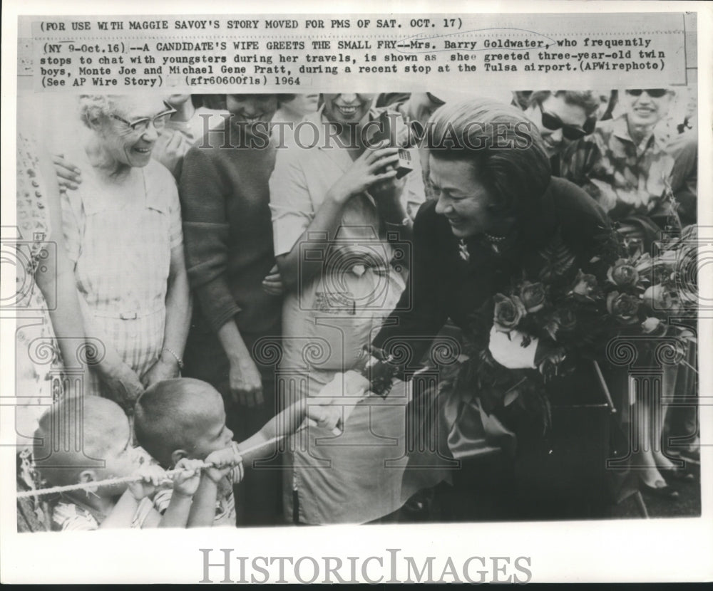 1964 Mrs. Goldwater greets three-year-old twins at Tulsa airport - Historic Images