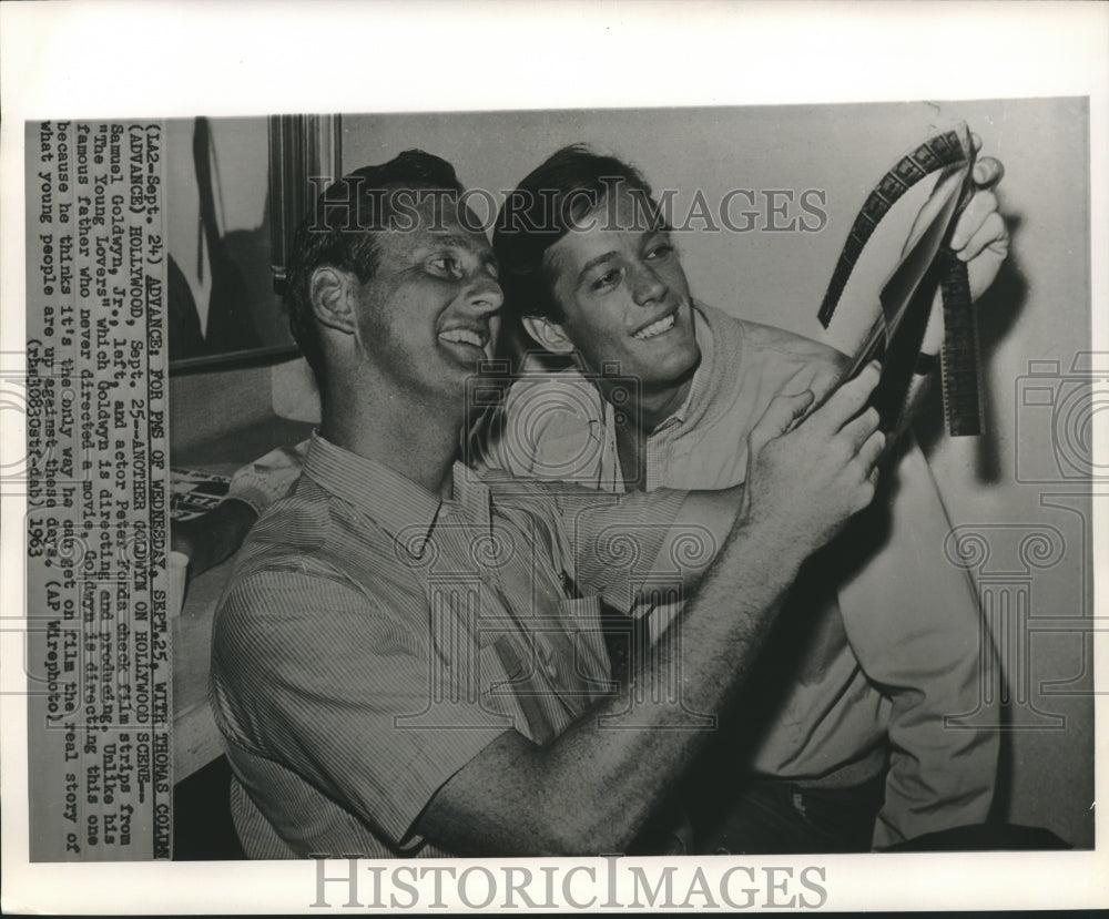 1963 Samuel Goldwyn, Jr. &amp; Peter Fonda check movie film strips - Historic Images