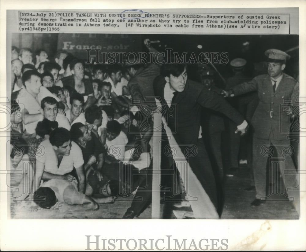 1965 Demonstrators fall atop each other to escape police in Athens - Historic Images