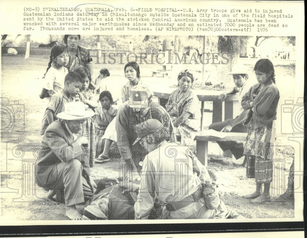 1976 Guatemala-U.S. Army troops give aid to injured from earthquake - Historic Images