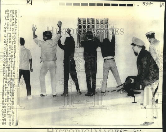 1970 Youth lined against a wall after Guatemala political shoot-out - Historic Images