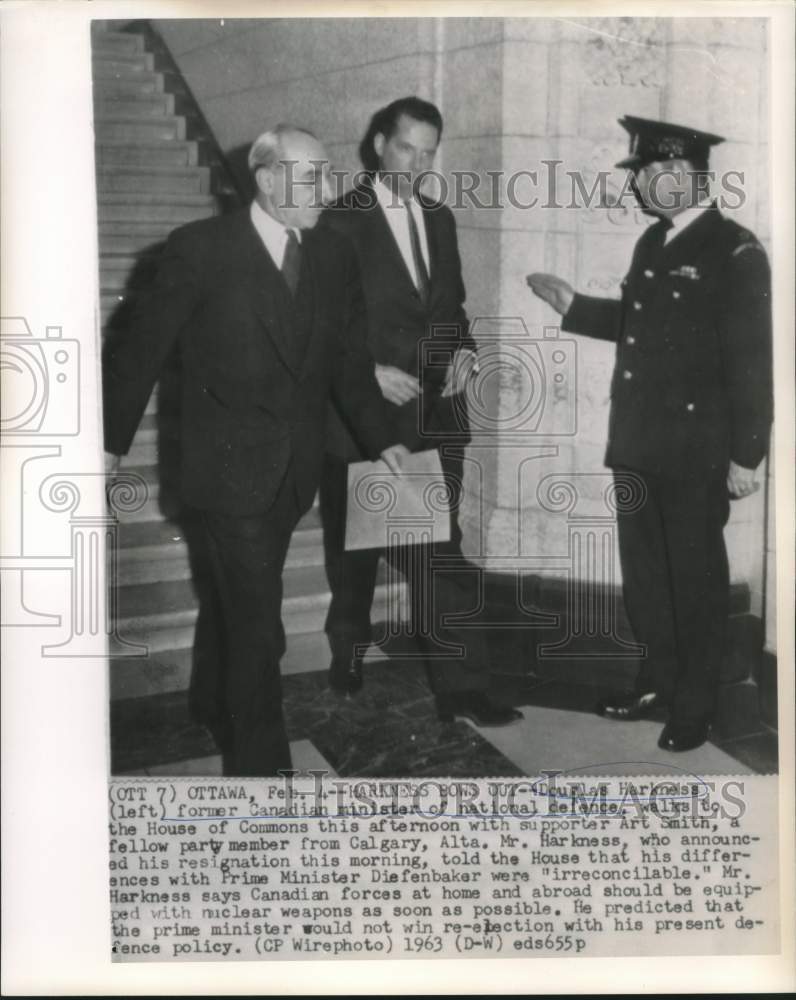 1963 Former Canadian Defense Minister walks to House of Commons. - Historic Images