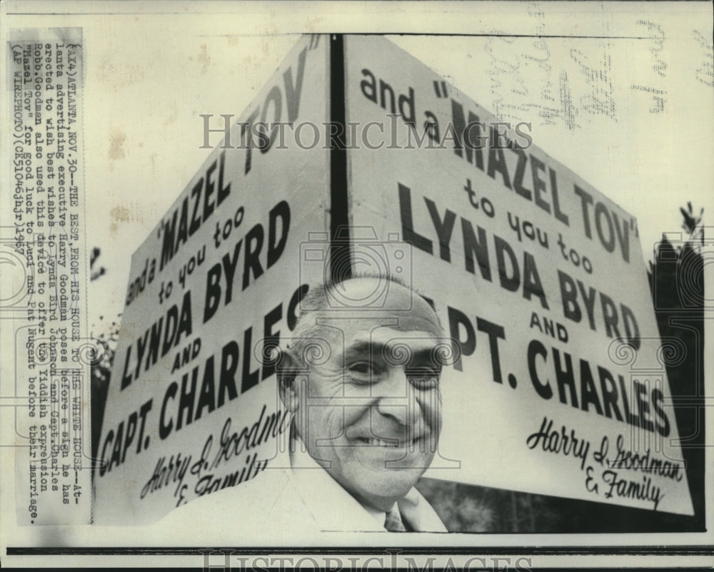 1967 Atlanta advertising executive Harry Goodman poses at sign - Historic Images