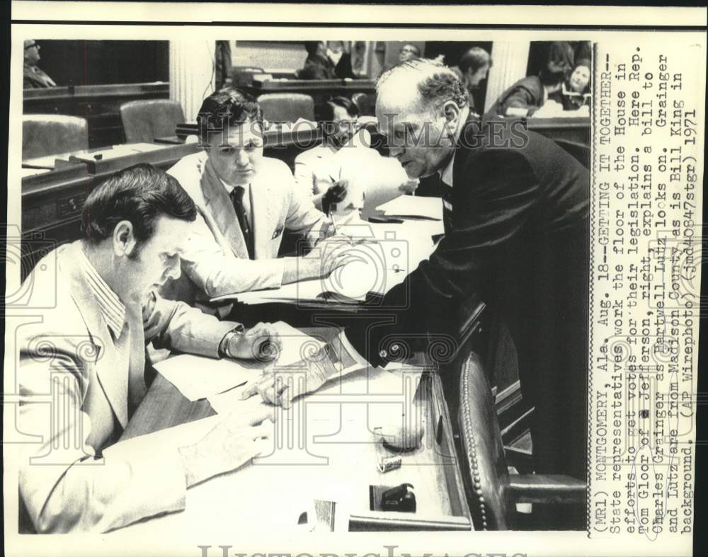 1971 State House Representatives Tom Gloor &amp; others look at bill. - Historic Images