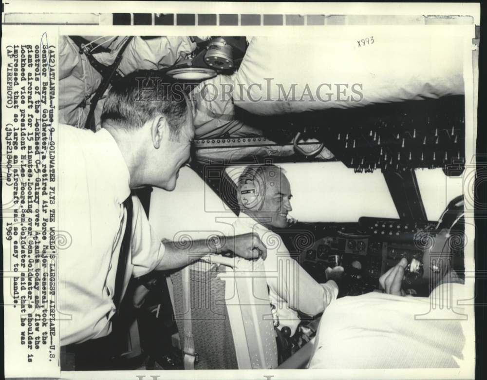 1969 Senator Barry Goldwater flies C-5 Galaxy aircraft over Atlanta - Historic Images