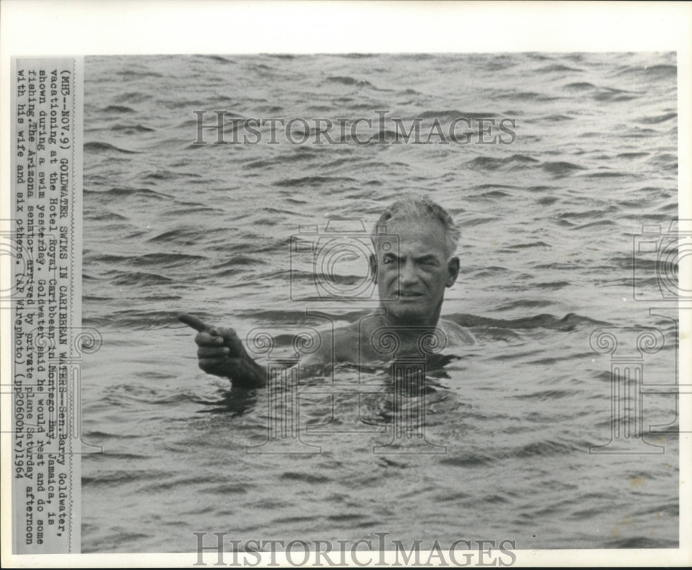 1964 Senator Goldwater swims in Montego Bay, Jamaica. - Historic Images