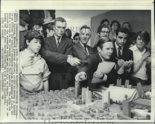 1969 Harold Goyette points to mock up of Harvard's expansion program - Historic Images
