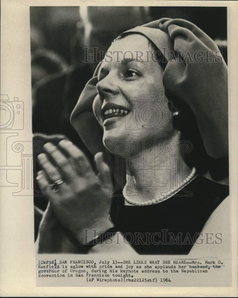 1964 Mrs. Mark Hatfield applauds husband, Governor of Oregon - Historic Images